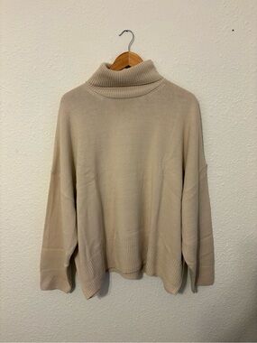 Shop Talulah Turtleneck Oversized Knit Sweater in Beige